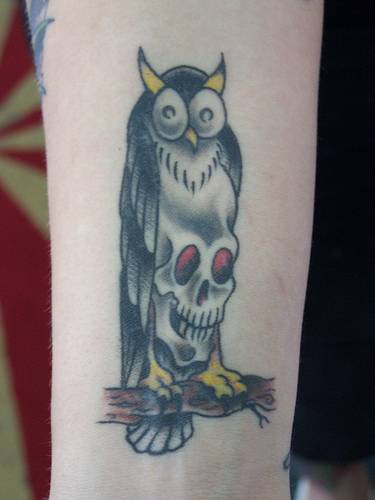 Owl with skull chest tattoo