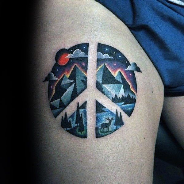 Pacific symbol shaped thigh tattoo stylized with mountains and night sky