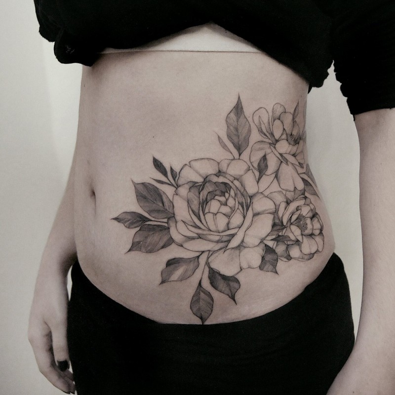 Painted by Zihwa outline style waist tattoo of large roses and leaves
