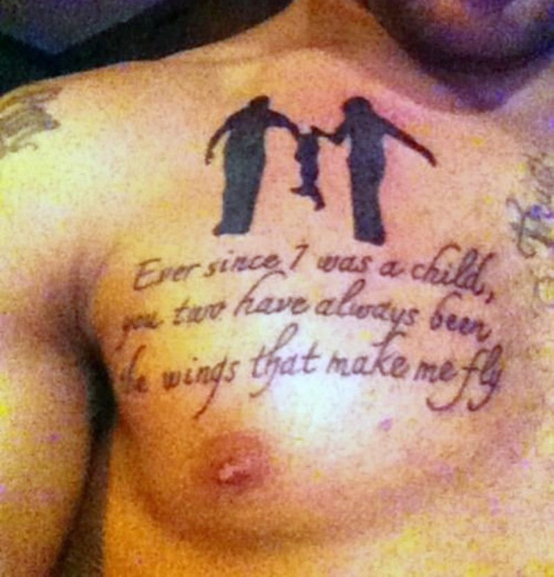 Parents carrying baby and emotional lettering black ink memorial tattoo on chest