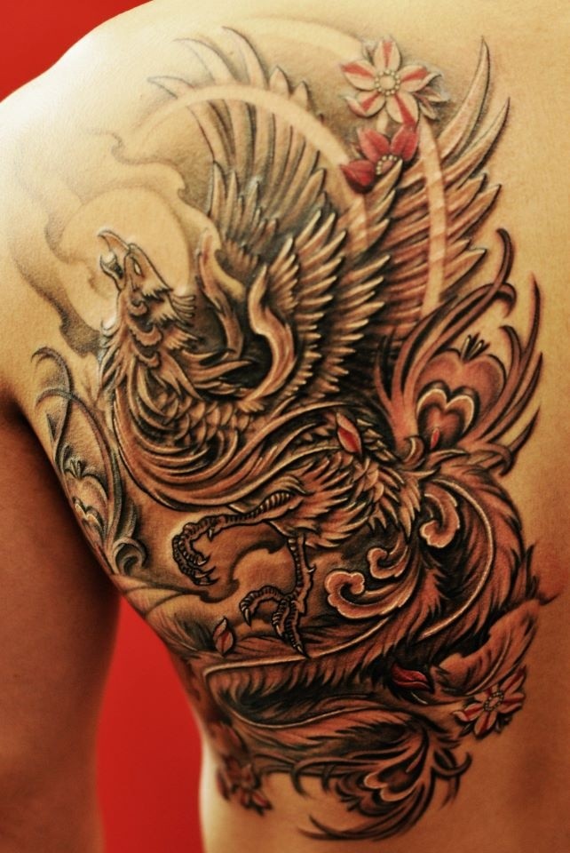 Phoenix tattoo on back by Chronic Ink