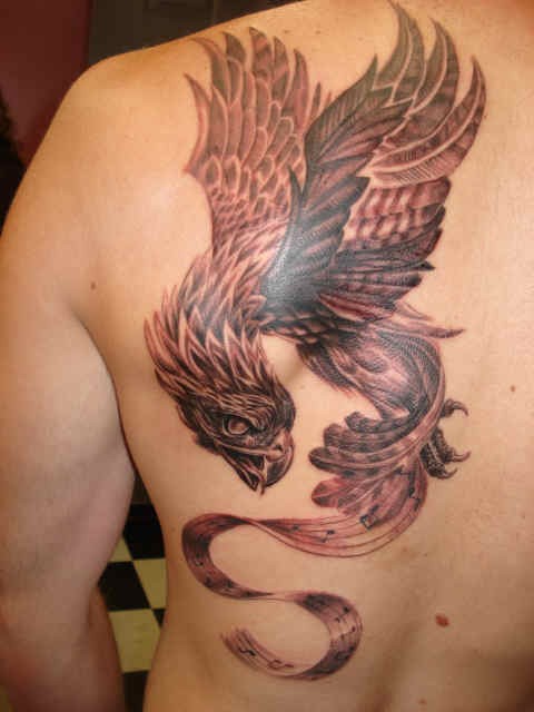 Phoenix tattoo on shoulder blade for men