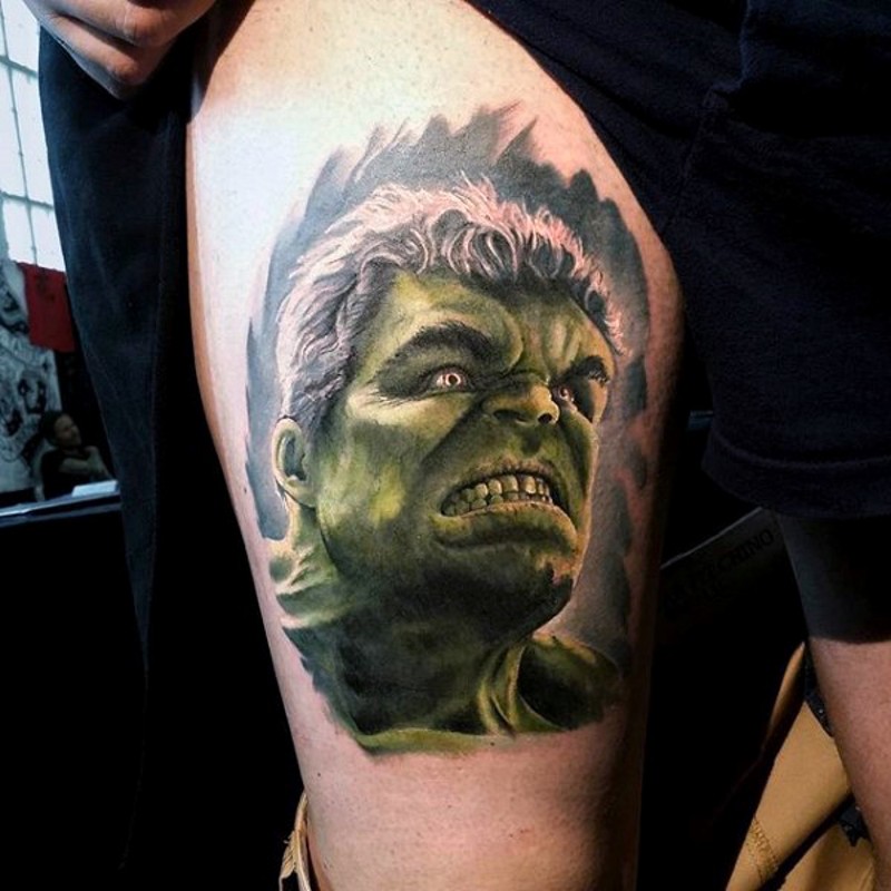 Photo like natural colored thigh tattoo of angry Hulk face