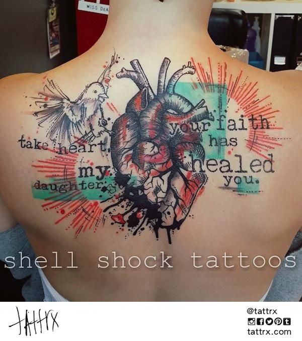 Photoshop colored back tattoo of human heart with lettering and bird