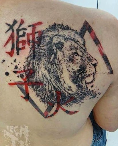 Photoshop style black ink lion face with lettering and red triangle