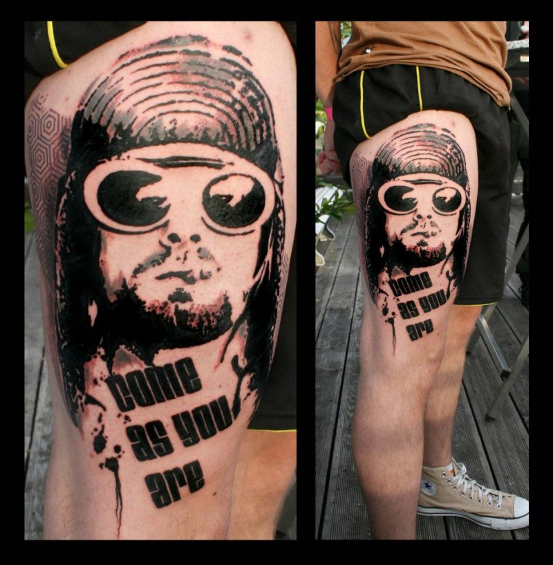 Photoshop style black ink thigh tattoo of smoking man in sun glasses with lettering