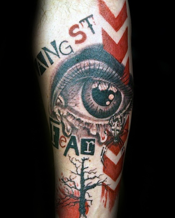 Photoshop style colored arm tattoo of human eye with lettering and spider