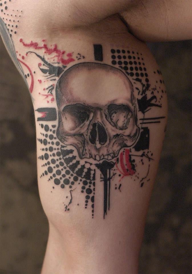 Photoshop style colored biceps tattoo of human skull with various ornaments