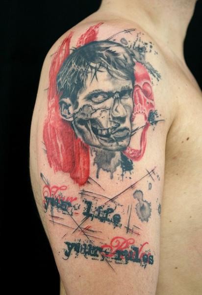 Photoshop style colored shoulder tattoo of human zombie with lettering