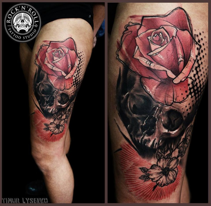 Photoshop style colored thigh tattoo of human skull and roses