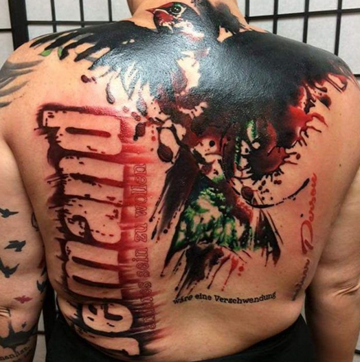 Photoshop style colored whole back tattoo of big bird with lettering