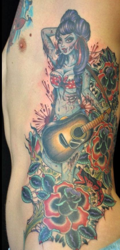 Pin up zombi girl with a guitar tattoo
