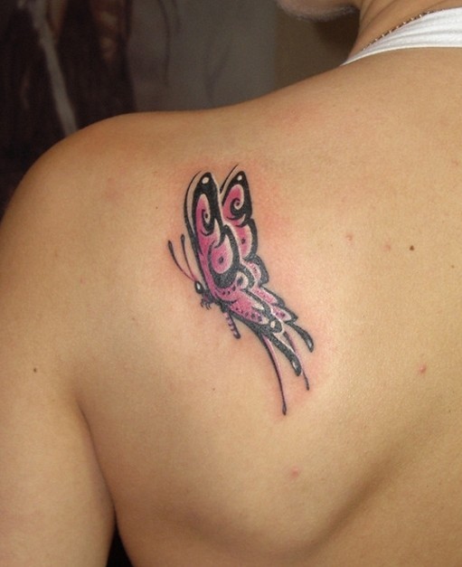 Pink small butterfly tattoo on shoulder