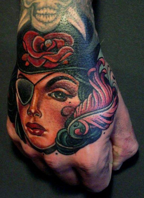 Pirate girl tattoo on hand by lars uwe