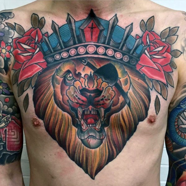 Pirate like colored chest tattoo of lion with crown and roses