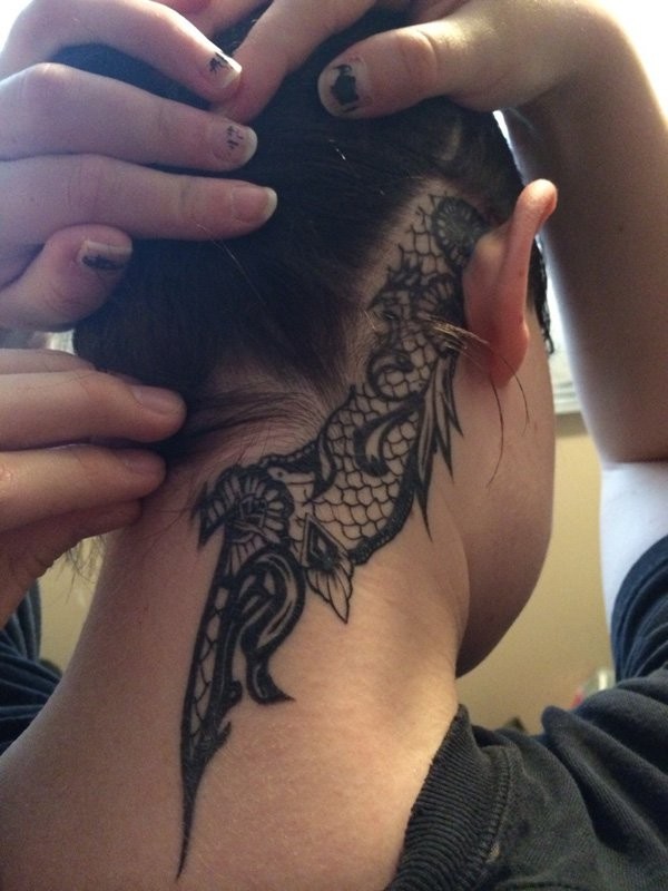 Polynesian style little black ink detailed ornaments tattoo on neck