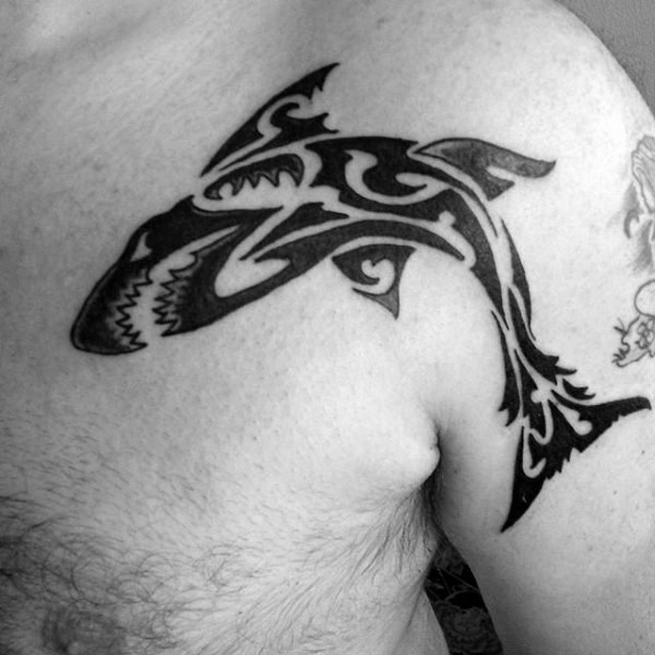 Polynesian style typical designed black ink shoulder tattoo of evil shark
