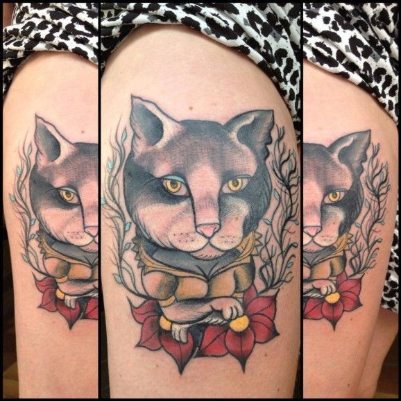 Portrait of a cat with red flowers tattoo by Nicoz Balboa