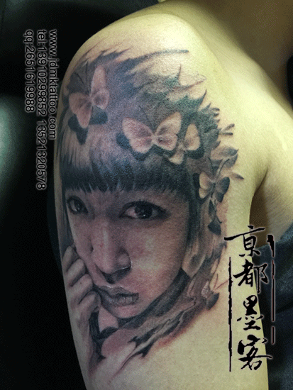 Portrait style black ink shoulder tattoo of Asian woman with butterflies