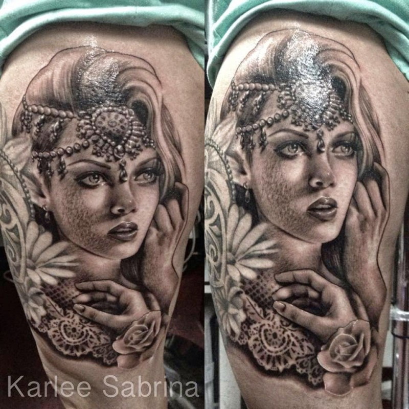 Portrait style black ink thigh tattoo of beautiful woman with jewelry