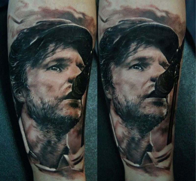 Portrait style colored arm tattoo