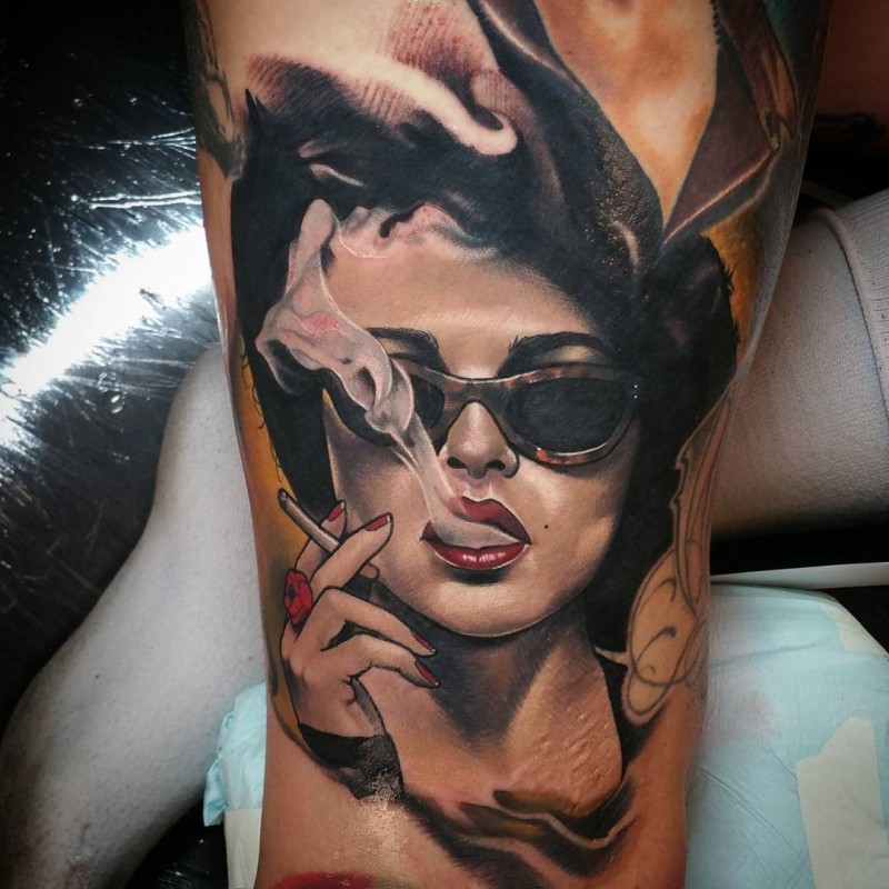 Portrait style colored arm tattoo of smoking seductive woman