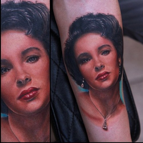 Portrait style colored arm tattoo of cute woman with jewelry