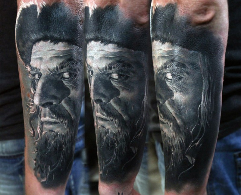 Portrait style colored arm tattoo of very detailed old pirate