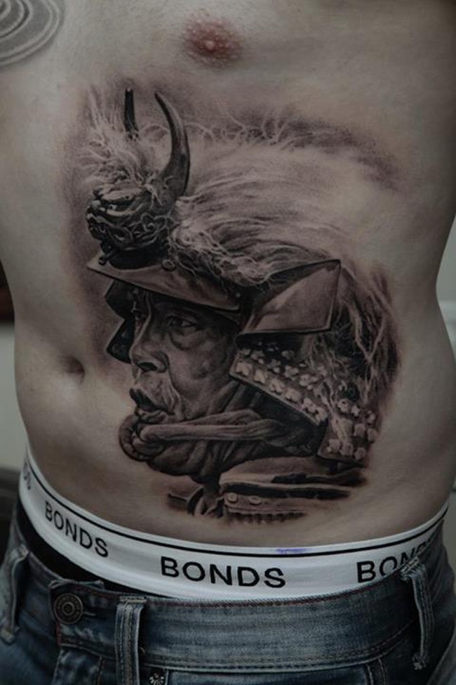 Portrait style colored belly tattoo of old Samurai with helmet