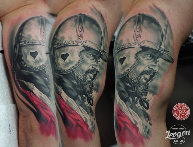 Portrait style colored biceps tattoo of medieval warrior with helmet