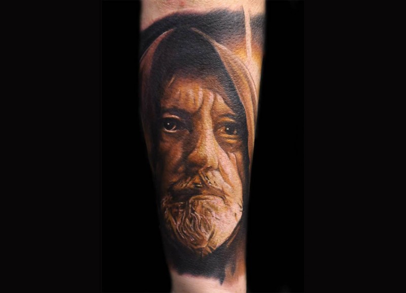 Portrait style colored forearm tattoo of Obi-wan Kenobi
