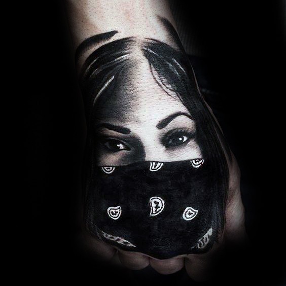 Portrait style colored hand tattoo of woman with mask