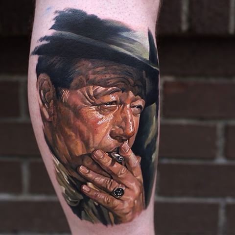 Portrait style colored leg tattoo of smoking old man