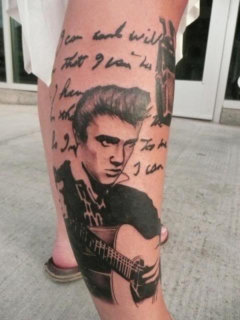 Portrait style colored leg tattoo of Elvis with guitar and lettering
