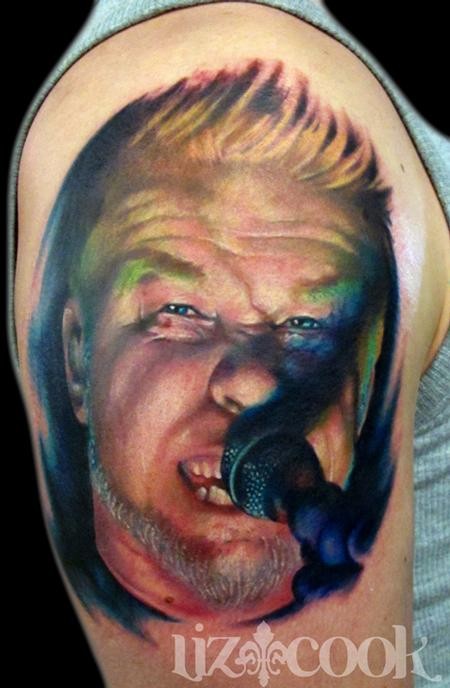 Portrait style colored Metallica singer face tattoo on shoulder