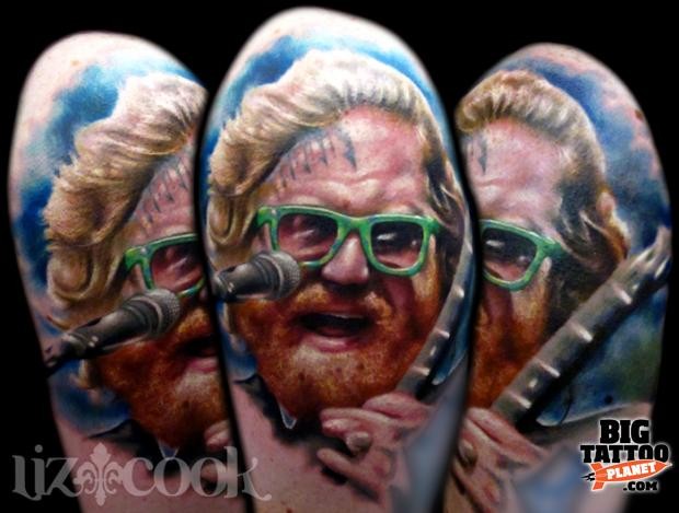 Portrait style colored shoulder tattoo of famous musician