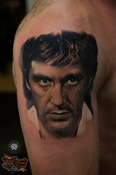 Portrait style colored shoulder tattoo of famous actor