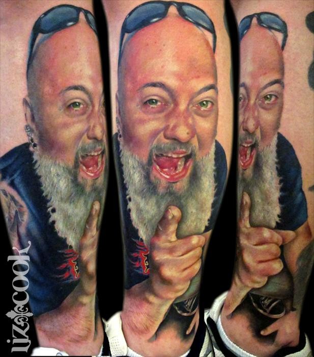 Portrait style colored smiling man face tattoo