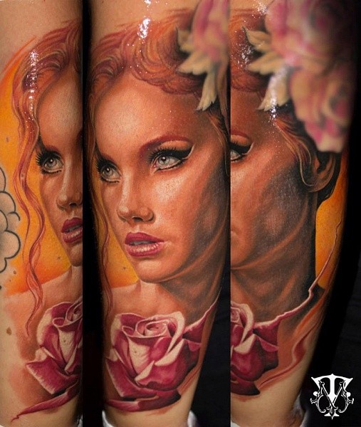 Portrait style colored tattoo of very beautiful woman with flowers