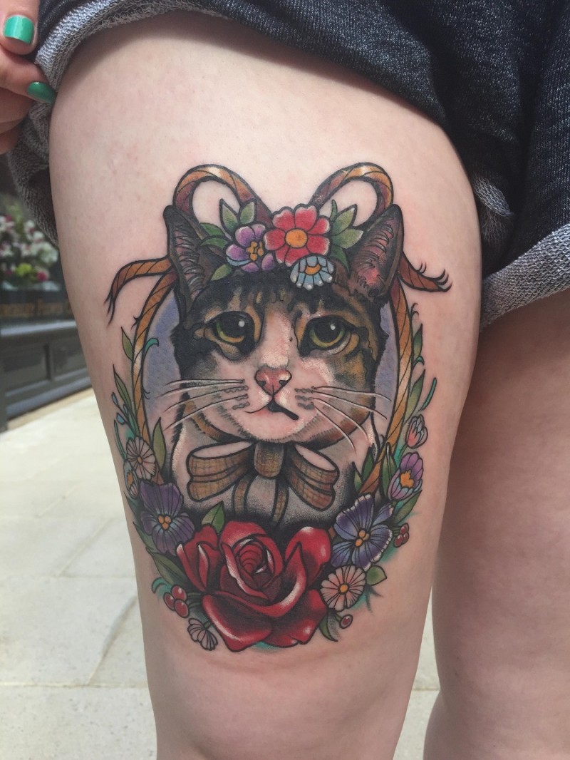 Portrait style colored thigh tattoo of cat with bow and flowers