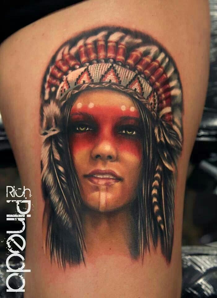 Portrait style colroed thigh tattoo of Indian woman with feather helmet