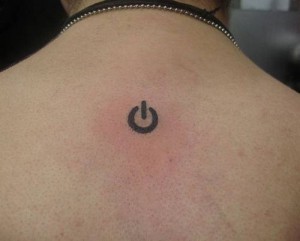 Power symbol geek tattoo on back