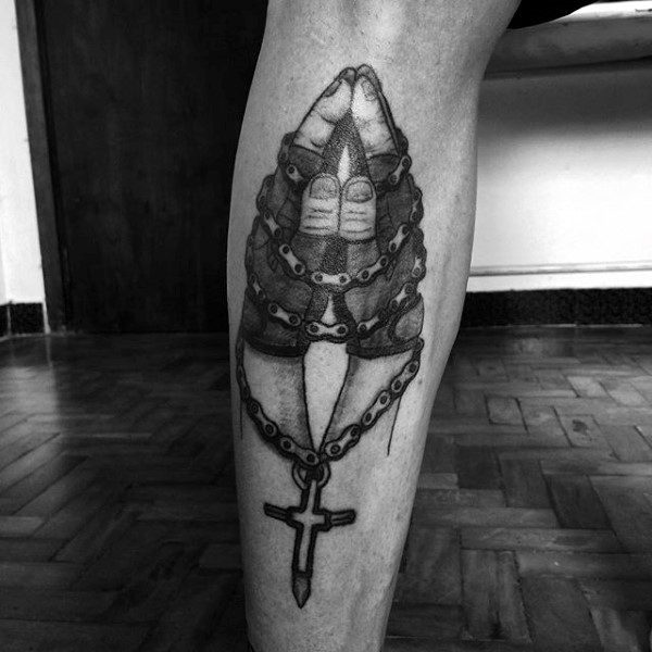 Praying hands with chained cross detailed realistic tattoo on leg