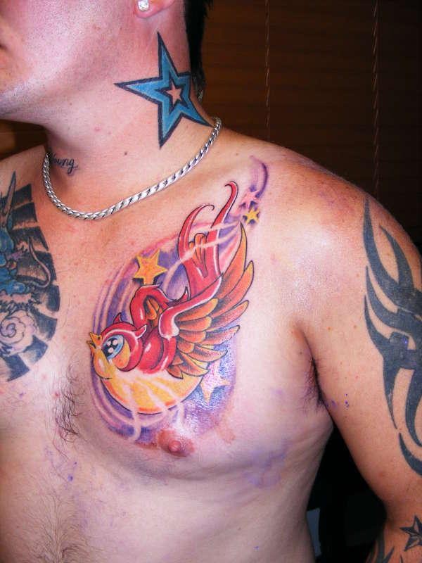 Pretty cartoon bird tattoo for guys
