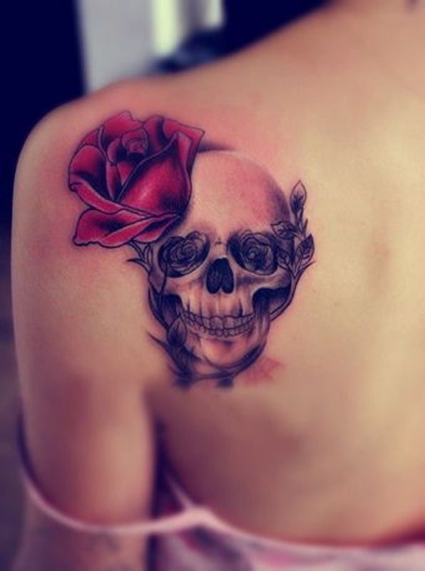 Pretty red rose with skull tattoo on shoulder blade