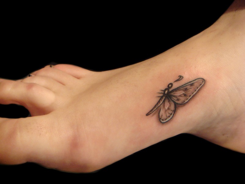 Pretty small butterfly tattoo on foot