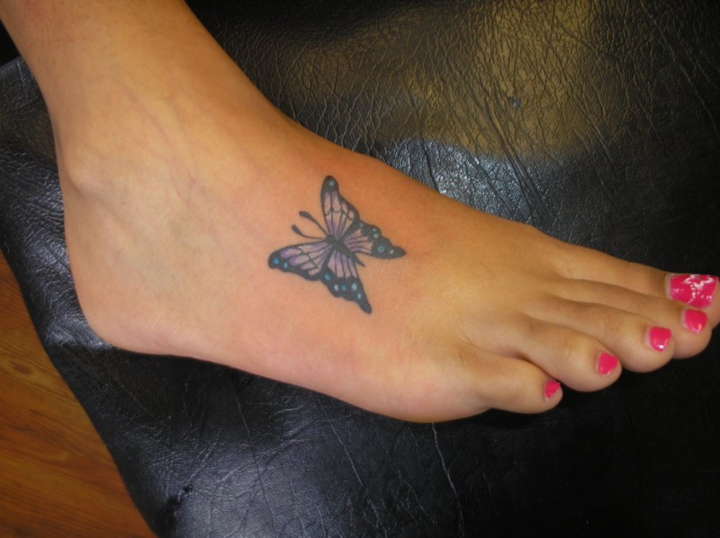 Pretty small butterfly tattoo on foot design 