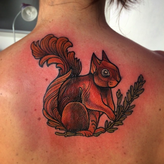 Pretty squirrel tattoo on back for female