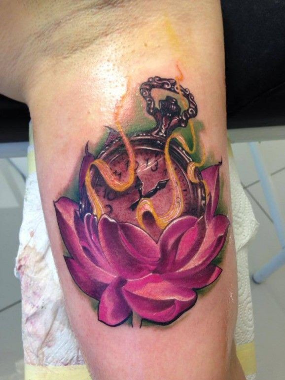 Purple flower with clock tattoo by Fabian de Gaillande