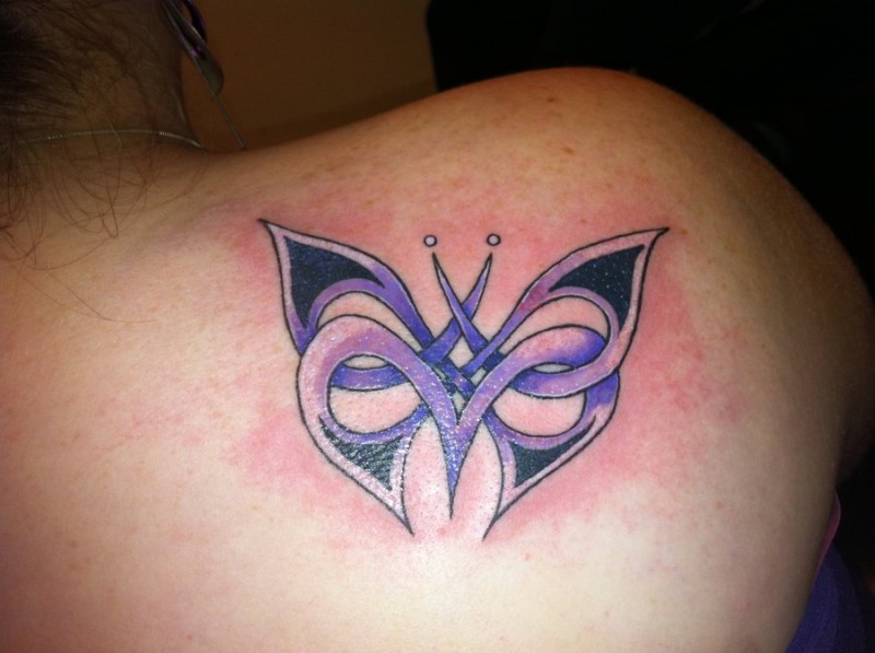 Purple ink celtic butterfly tattoo on shoulder for her